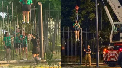 Intenta brincar barda para ingresar a Fan Fest y termina rescatada con grúa