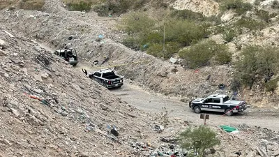 Localizan persona sin vida envuelta en cobija en terracería de Felipe Ángeles